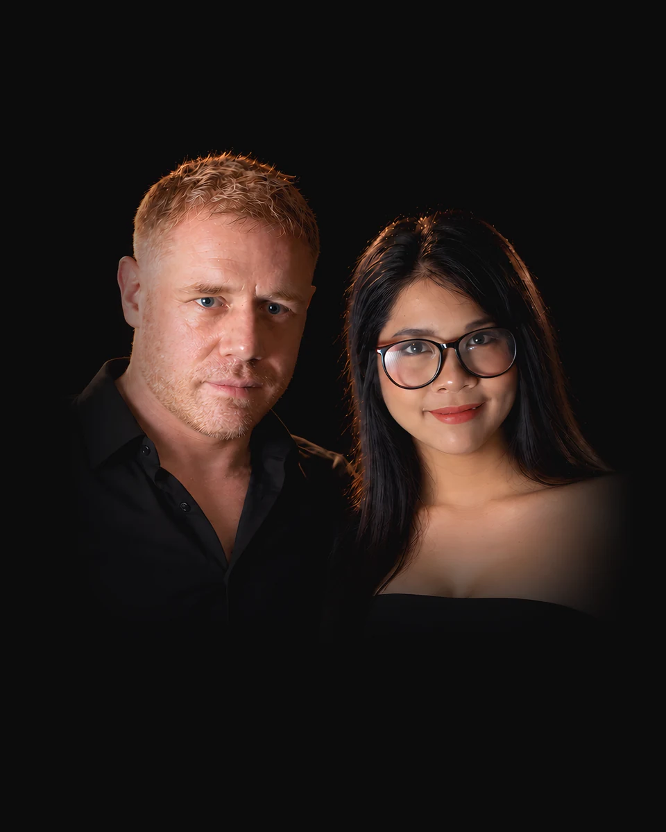 Tim and Paemi, who run Pattaya Authority, side by side in black.