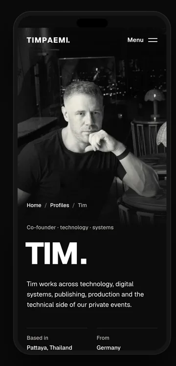 Tim’s profile on a phone, with his black and white photo.